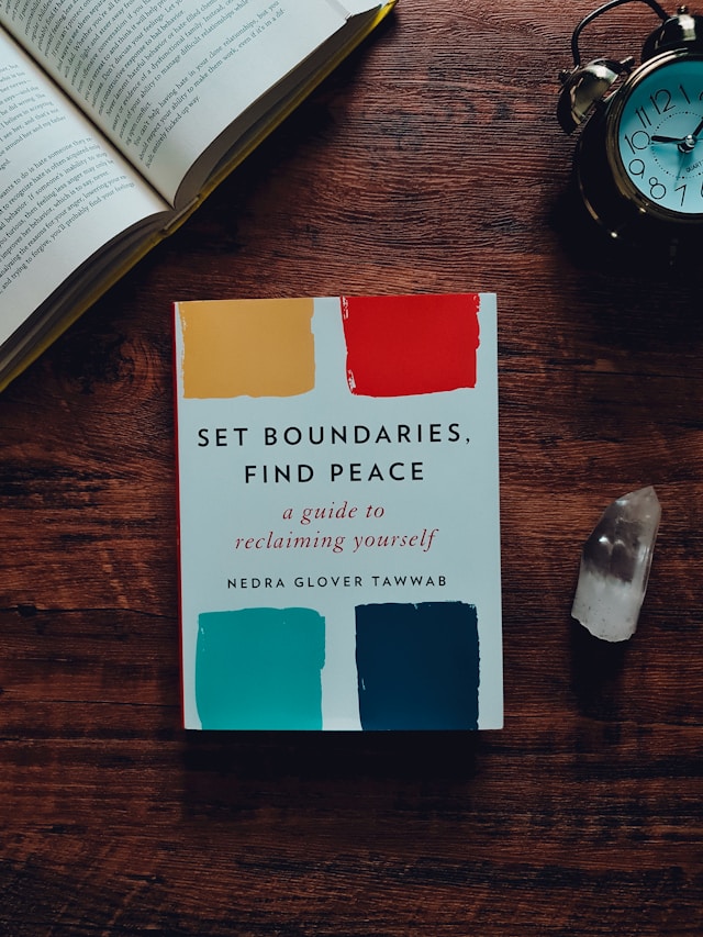 Setting Boundaries book A self-help book on setting boundaries rests on top of a desk